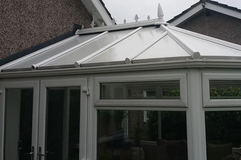 Conservatory roof after cleaning — panels restored to bright white
